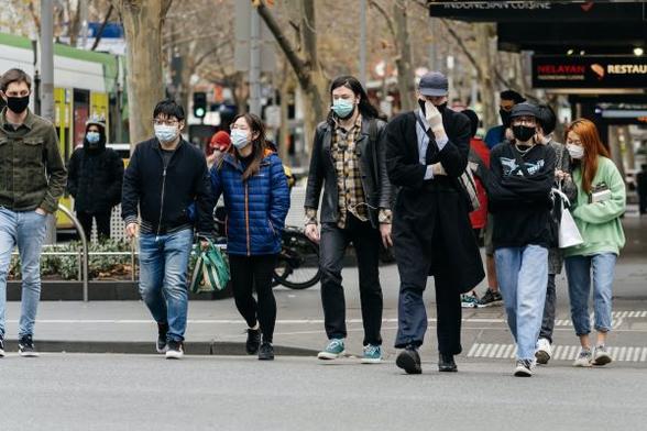 People walking down the street.