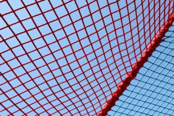 Image of a safety net against a blue sky
