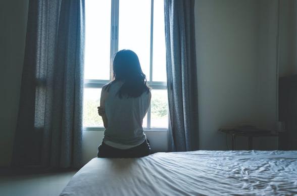 Woman looking towards window