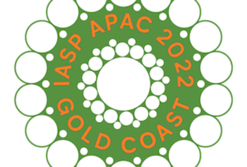 Abstract logo of a flower with the words IASP APAC 2022 Gold Coast