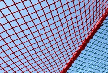 Image of a safety net against a blue sky